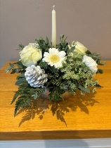 Silver and white candle arrangement in a silver container